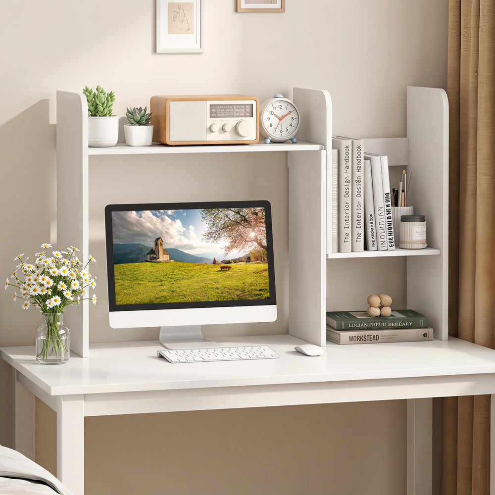 Expandable desk bookshelf in white with open cubes and desktop display rack, ideal for organized storage and monitor support.