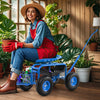 Blue extendable handle garden cart with ergonomic seat, large wheels, and tool tray, ideal for gardening tasks indoors.