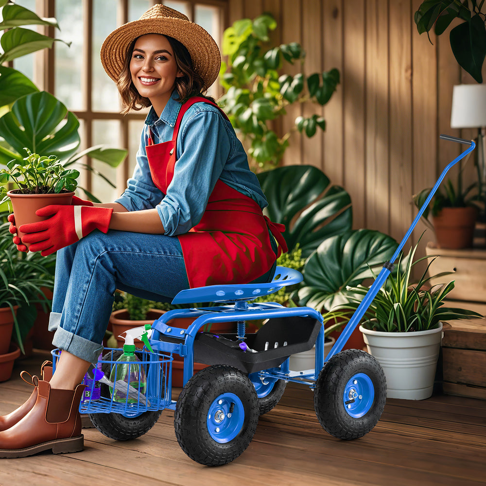 Blue extendable handle garden cart with ergonomic seat, large wheels, and tool tray, ideal for gardening tasks indoors.