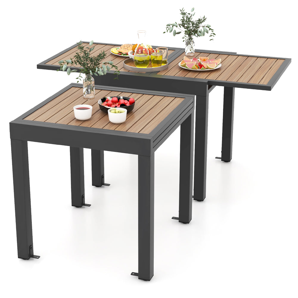 Extendable patio table with a wood-like slatted top, accommodating 4-6 people, perfect for outdoor gatherings.
