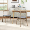Two fabric upholstered dining chairs with rubber wood frames, featuring curved backrests, in a stylish kitchen setting.