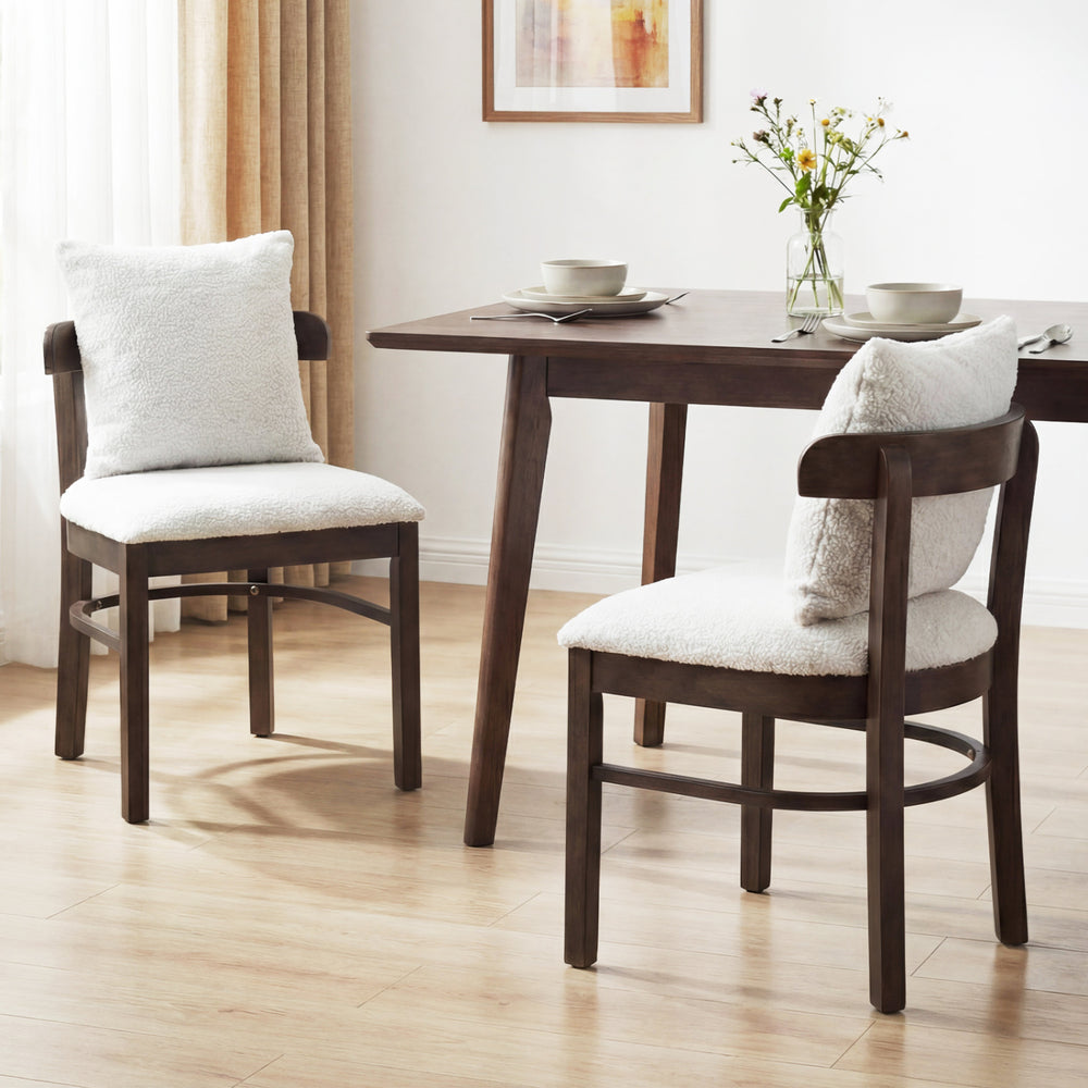 Set of 2 gray fabric upholstered dining chairs with removable pillows, featuring solid rubber wood legs for durability.