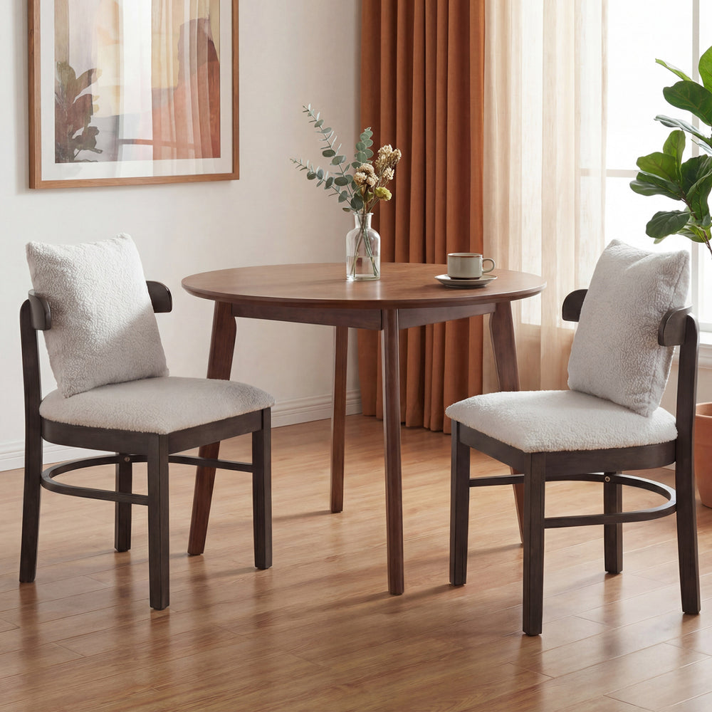 Gray fabric upholstered dining chair with a curved backrest, removable pillow, and solid rubber wood legs for lasting.