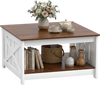 Square farmhouse coffee table in white with a wood top, featuring a storage shelf for books and decor.
