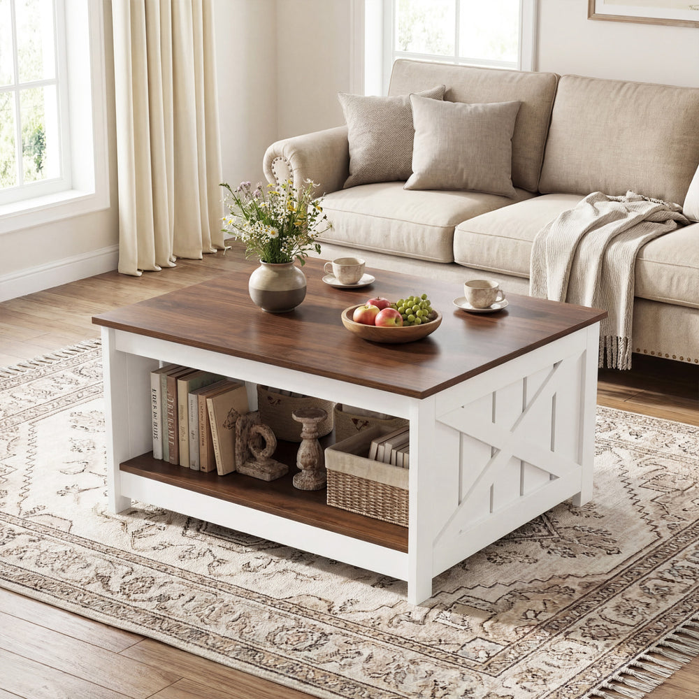 Farmhouse coffee table with a thickened wood top, white base, and open storage shelf for books and decor.