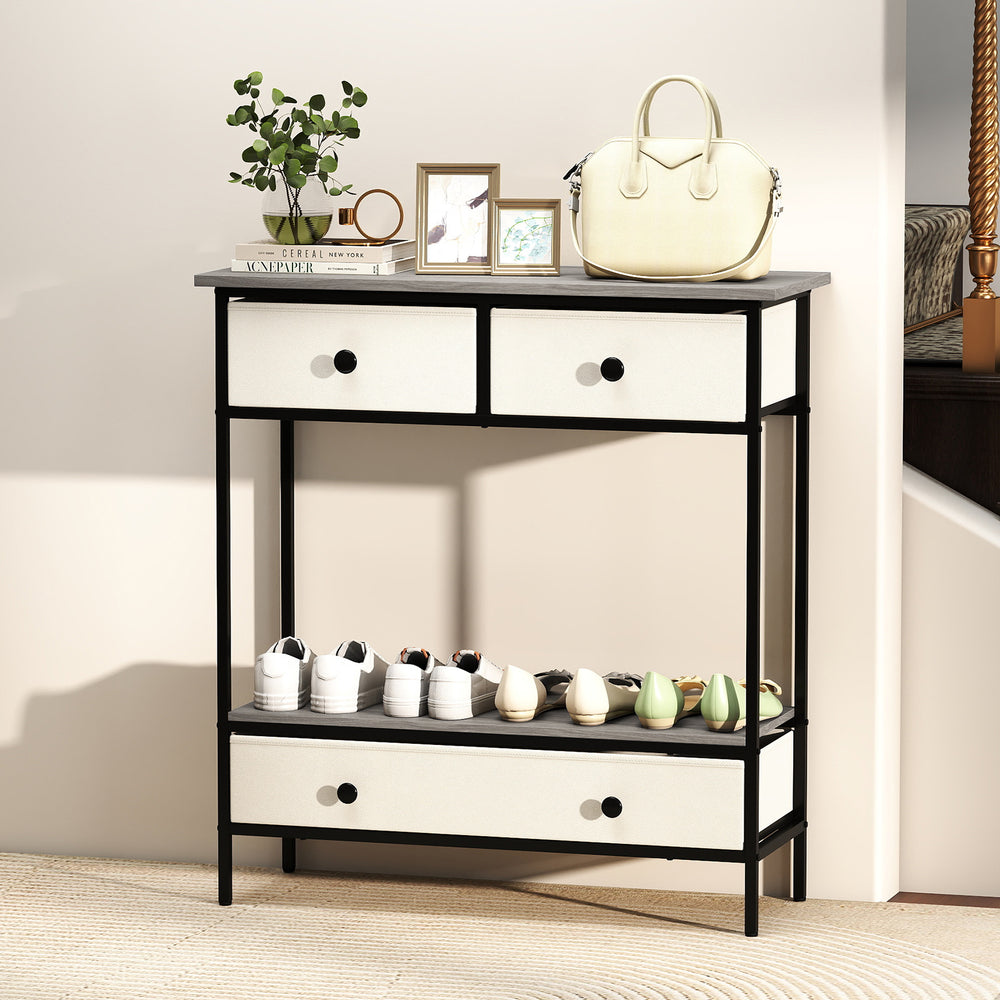 Farmhouse console table with gray finish, featuring three drawers and an open shelf for hallway storage and display.