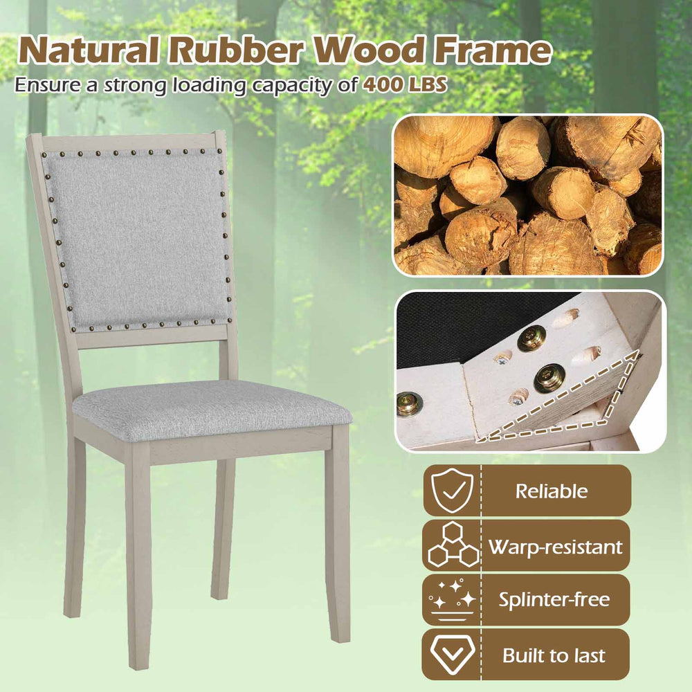 Farmhouse dining chair with grey fabric upholstery, rubber wood frame, and vintage nailheads for elegant dining decor.