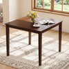 Square dining table with rubber wood legs, paired with armless chairs, ideal for space-saving in dining rooms.