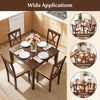 Square walnut farmhouse dining table for 4 people, set in a kitchen with plates and flowers for a cozy dining.