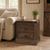 Brown farmhouse nightstand with two drawers, featuring vintage handles and a stable base, ideal for bedside storage.