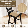 Well-woven PE rattan seat on a black rubber wood dining chair, combining comfort and vintage charm for dining spaces.