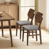 Set of 2 farmhouse upholstered kitchen chairs with rubber wood frame and gray padded seats for comfortable dining.