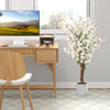 Faux plum blossom plant with white fabric flowers and solid wood trunk, perfect for elegant office decor.