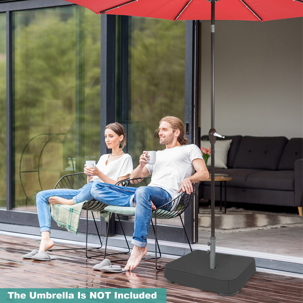 Square umbrella base with two sandbags and dust-proof cover, providing stable support for outdoor umbrellas up to 15ft.