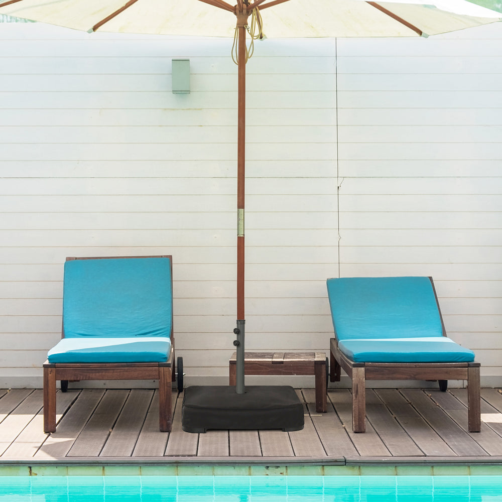 Square umbrella base with two sandbags, dust-proof cover, and sturdy metal frame for outdoor umbrella stability.