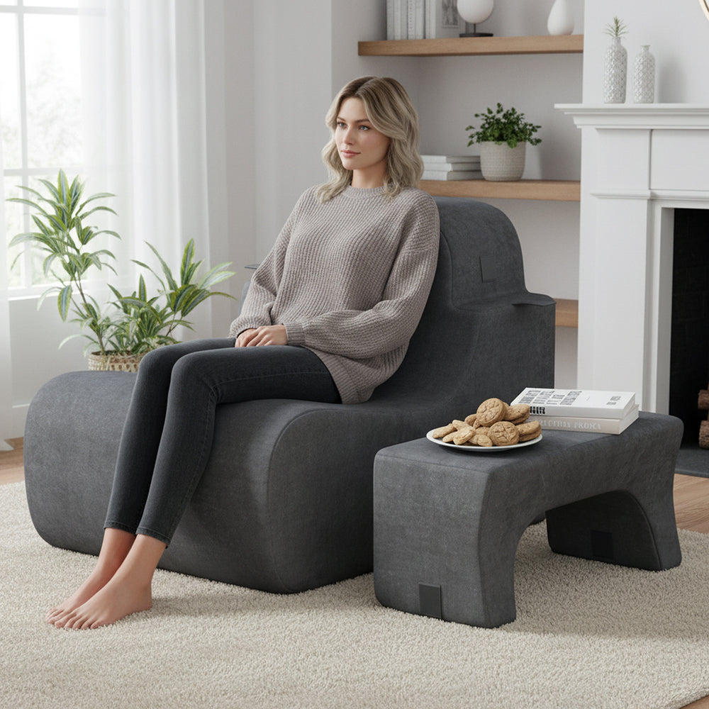 Curved gray floor chair with detachable headrest, made of soft sponge and ice velvet, ideal for relaxing or reading.