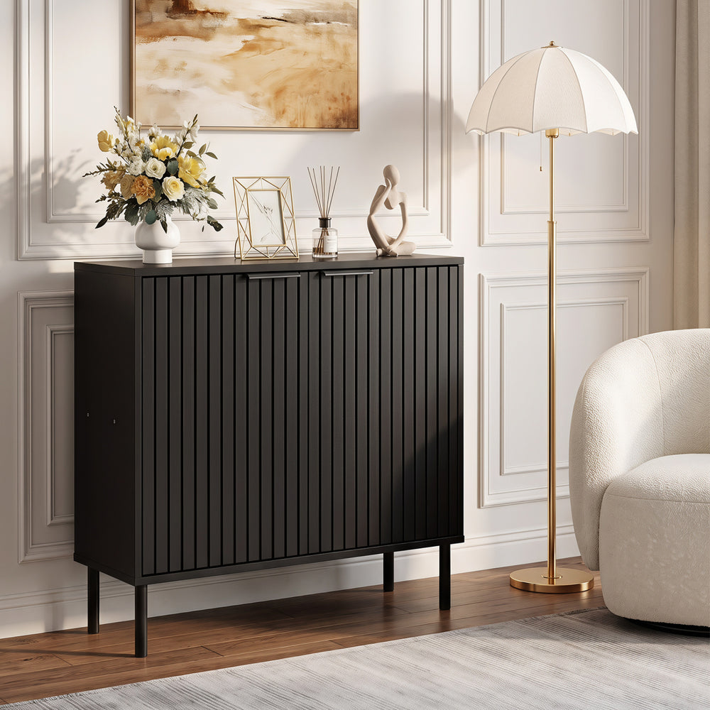 Fluted black buffet cabinet with two doors, spacious tabletop, and metal legs for versatile use in kitchen or dining room.