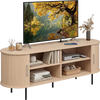Fluted TV stand with curved design, natural finish, and multiple compartments for organized storage and decor.