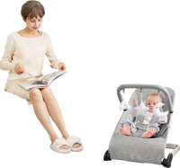 Foldable baby bouncer in gray with removable cover and toy bar, designed for comfort and safety, perfect for infants.