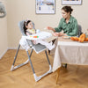 Foldable baby high chair in light gray with adjustable height and reclining seat, perfect for mealtime comfort.