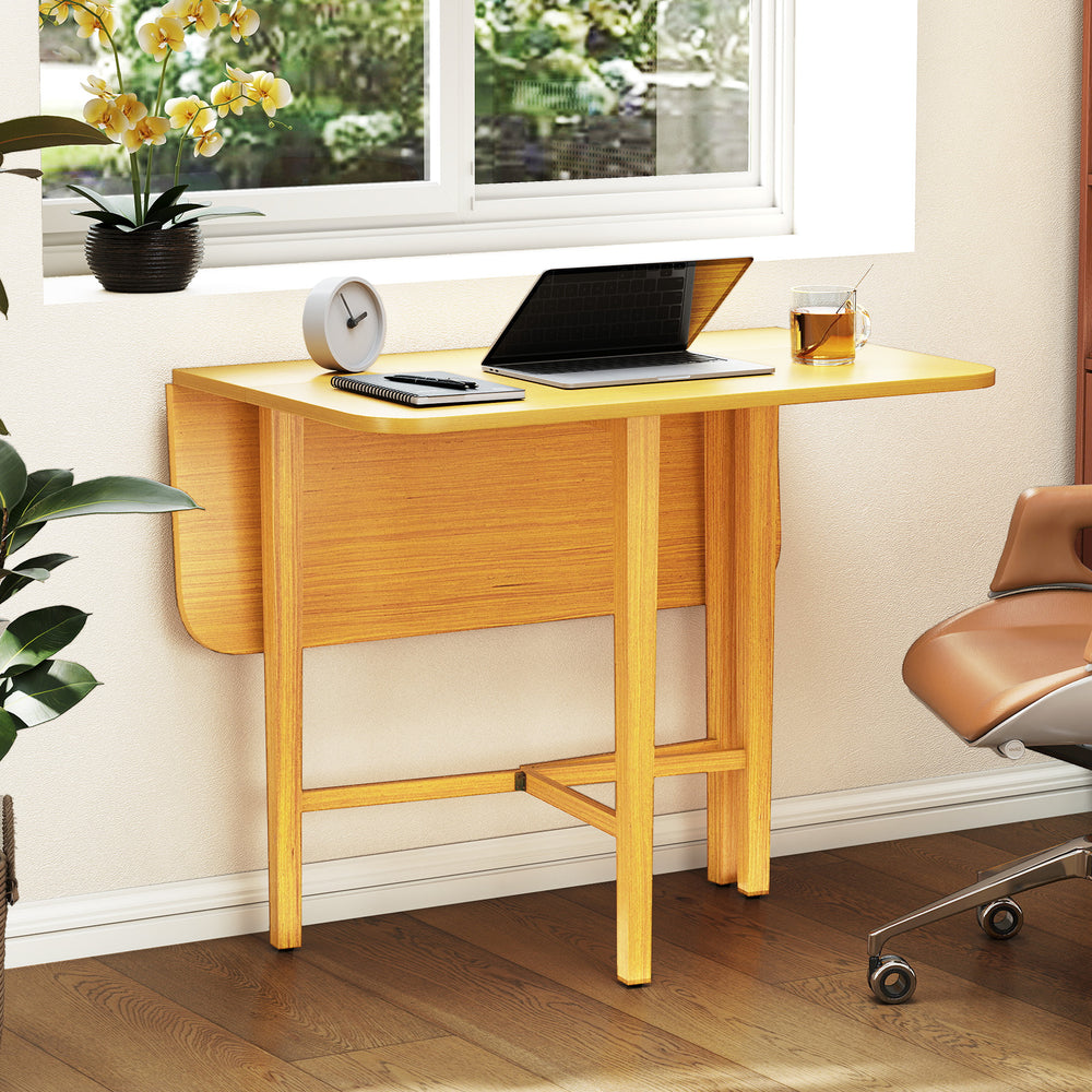 Foldable dining table with rubber wood legs, featuring drop leaf panels, ideal for small spaces and versatile use.