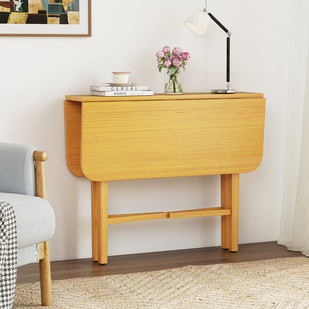 Foldable dining table with rubber wood legs, featuring drop leaf design, perfect for small spaces or as a console table.