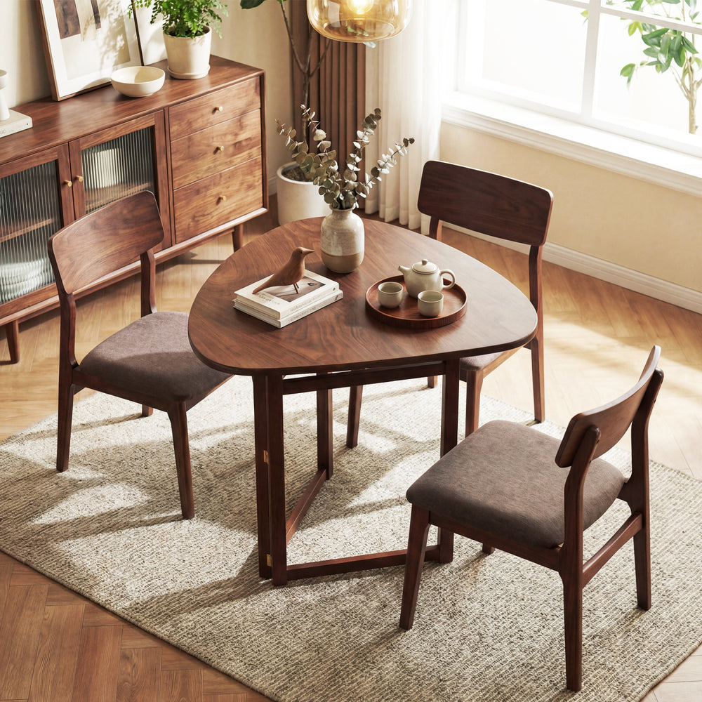 Triangular 31.5" foldable dining table in walnut finish with rubber wood legs, perfect for small kitchens or dining.
