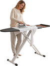 Foldable full-size ironing board with a heat-resistant surface and adjustable height for comfortable ironing in small spaces.