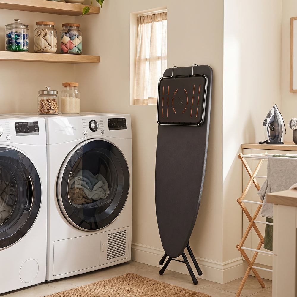 Space-saving foldable ironing board with a stable cross-shaped frame and padded heat-resistant surface for laundry rooms.