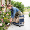 Foldable garden kneeler and seat in navy, featuring a detachable cushion and side pouch for easy gardening tasks.