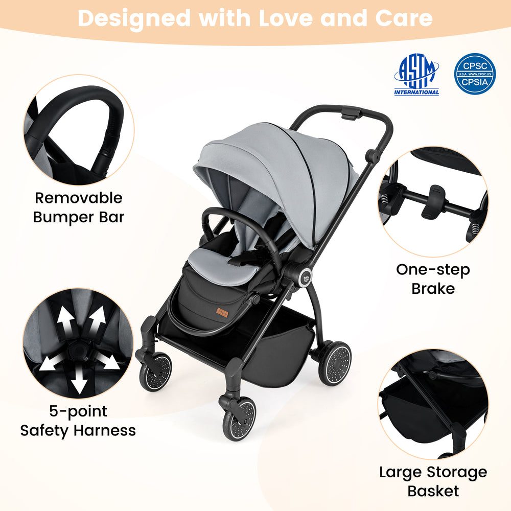 Foldable infant pram stroller in gray with a reversible seat, 5-point harness, and large storage basket for convenience.