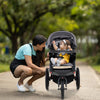 Foldable jogging stroller in gray with detachable tray, air-filled rubber tires, and adjustable canopy for infants and.
