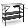 Foldable outdoor cook station in black includes four S-hooks for organizing cooking tools and a bottle opener for convenience.