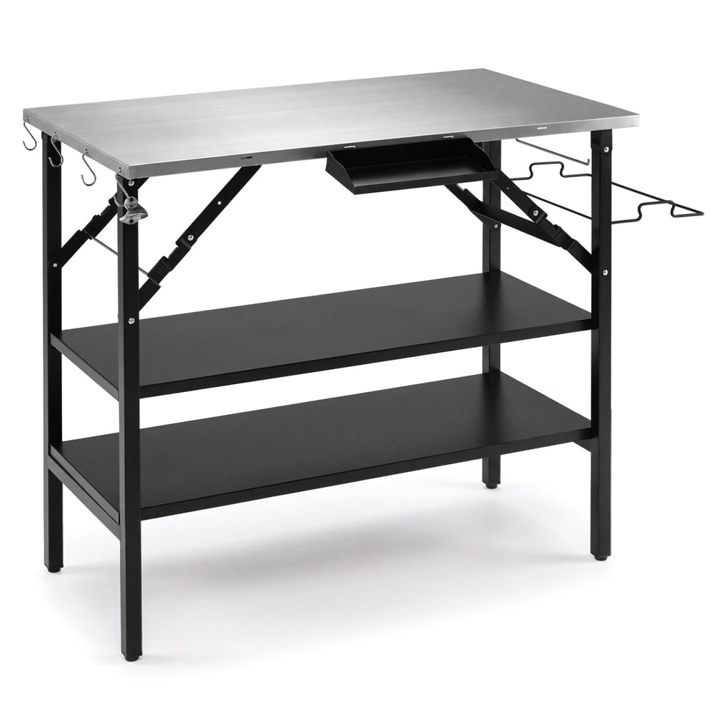 Foldable outdoor cook station in black includes four S-hooks for organizing cooking tools and a bottle opener for convenience.