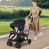 Foldable twin tandem stroller in black with adjustable handlebar, accommodating two kids for convenient outings.
