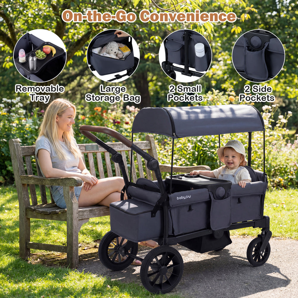 Side view of the foldable gray wagon stroller for 2 kids, showcasing the spacious seating and removable snack tray for.