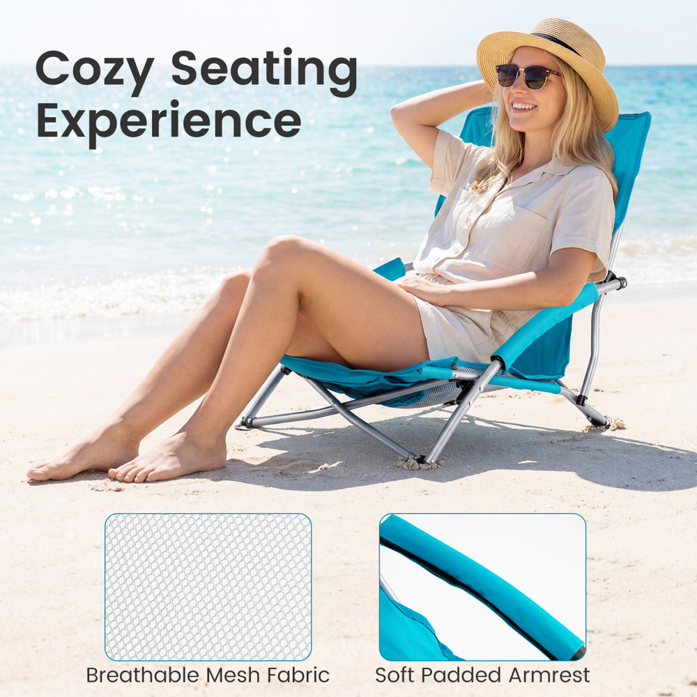 Lightweight blue folding beach chair with padded armrests and breathable mesh fabric, perfect for outdoor relaxation.