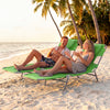 Folding beach lounge chair in lawn-green, adjustable backrest, perfect for relaxing on the sand or by the pool.