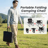 Portable folding camping chair in black with side table and cup holder, ideal for picnics and outdoor activities.