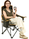 Folding camping chair with footrest in black, featuring adjustable backrest and cup holder, perfect for outdoor.