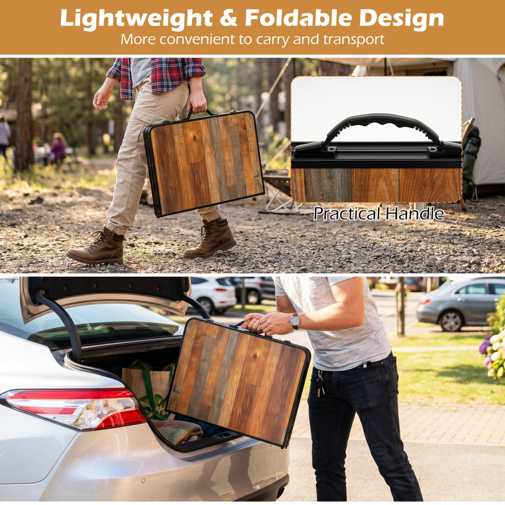 Folding camping table with adjustable heights, black and brown finish, featuring a practical handle for easy transport.