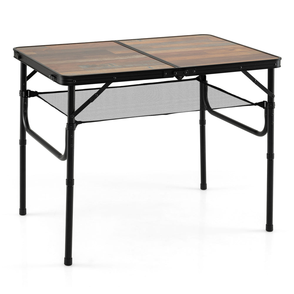 Folding camping table in black and brown with adjustable heights, storage net, and handle for outdoor convenience.