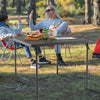 Folding camping table with gray all-weather HDPE top and rustproof steel frame, perfect for outdoor use and easy.