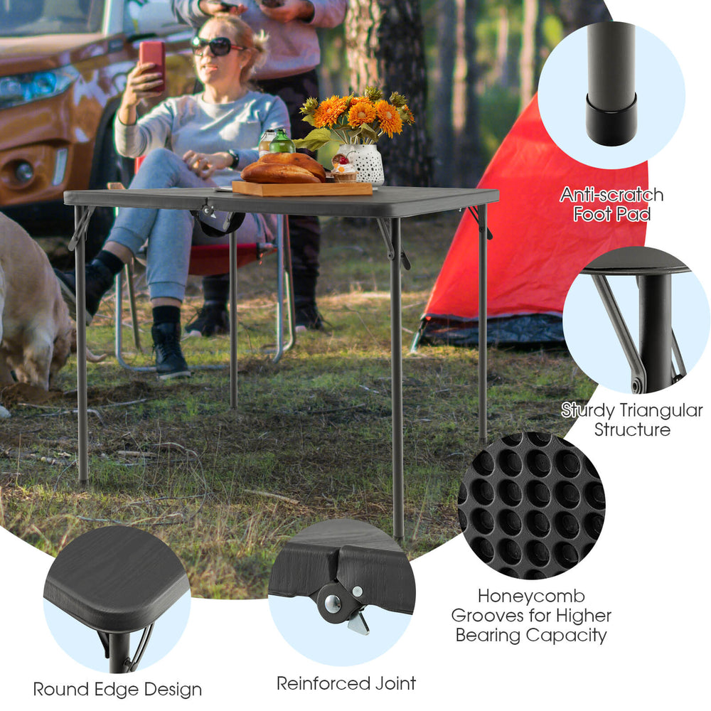 Folding camping table with gray HDPE tabletop and rustproof steel frame, perfect for outdoor use and accommodates 4.