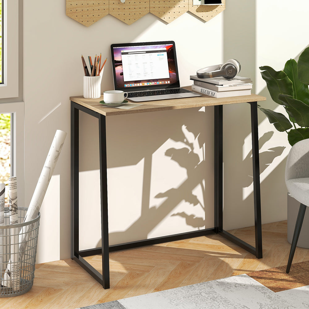 Folding computer desk with a natural wood finish and sturdy metal frame, perfect for small spaces and home offices.