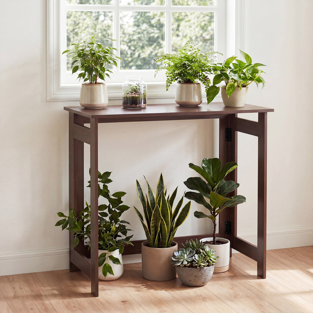 Folding console table in brown with foldable legs, ideal for space-saving storage in hallways or living rooms.