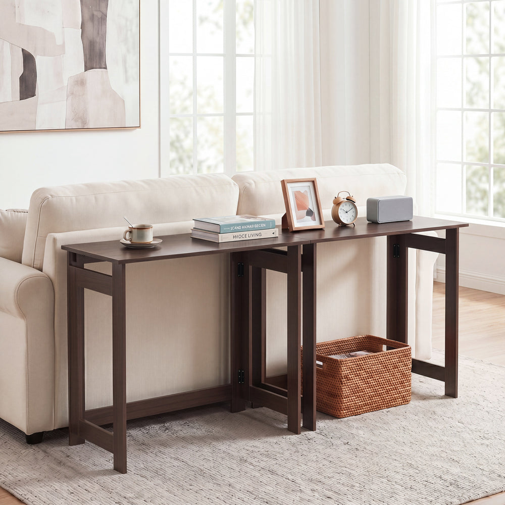 Folding console table with foldable legs in brown, featuring a spacious tabletop for versatile use in living spaces.