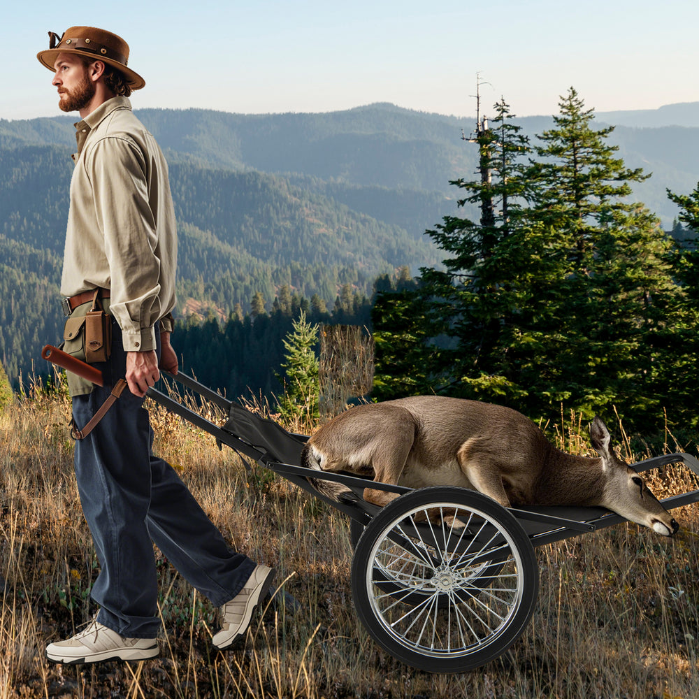 Folding deer game cart with polyester liner, 550 lbs capacity, shown in use for hunting in a forested area.