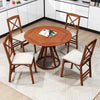 Round dining table with four folding chairs featuring padded seats and rubber wood frames, perfect for small spaces.