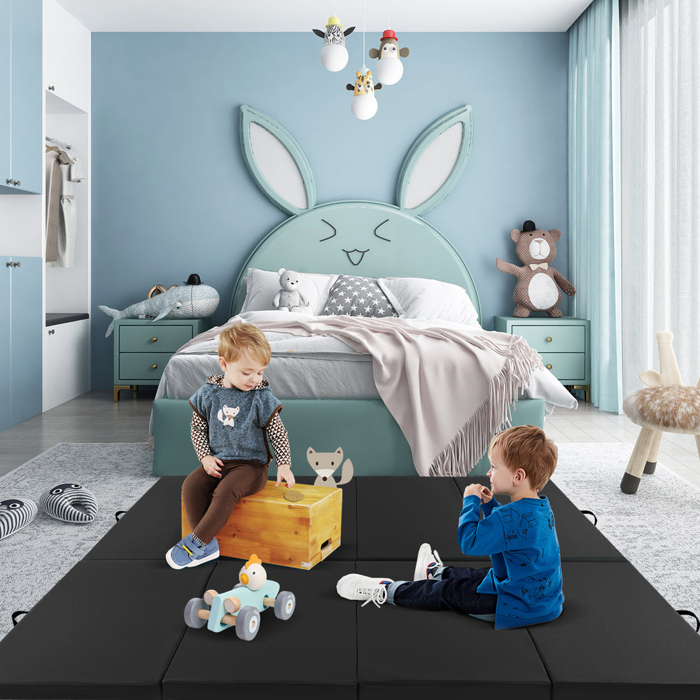 Black 4-panel PU leather folding exercise mat with kids playing, featuring carrying handles and high-density foam for.